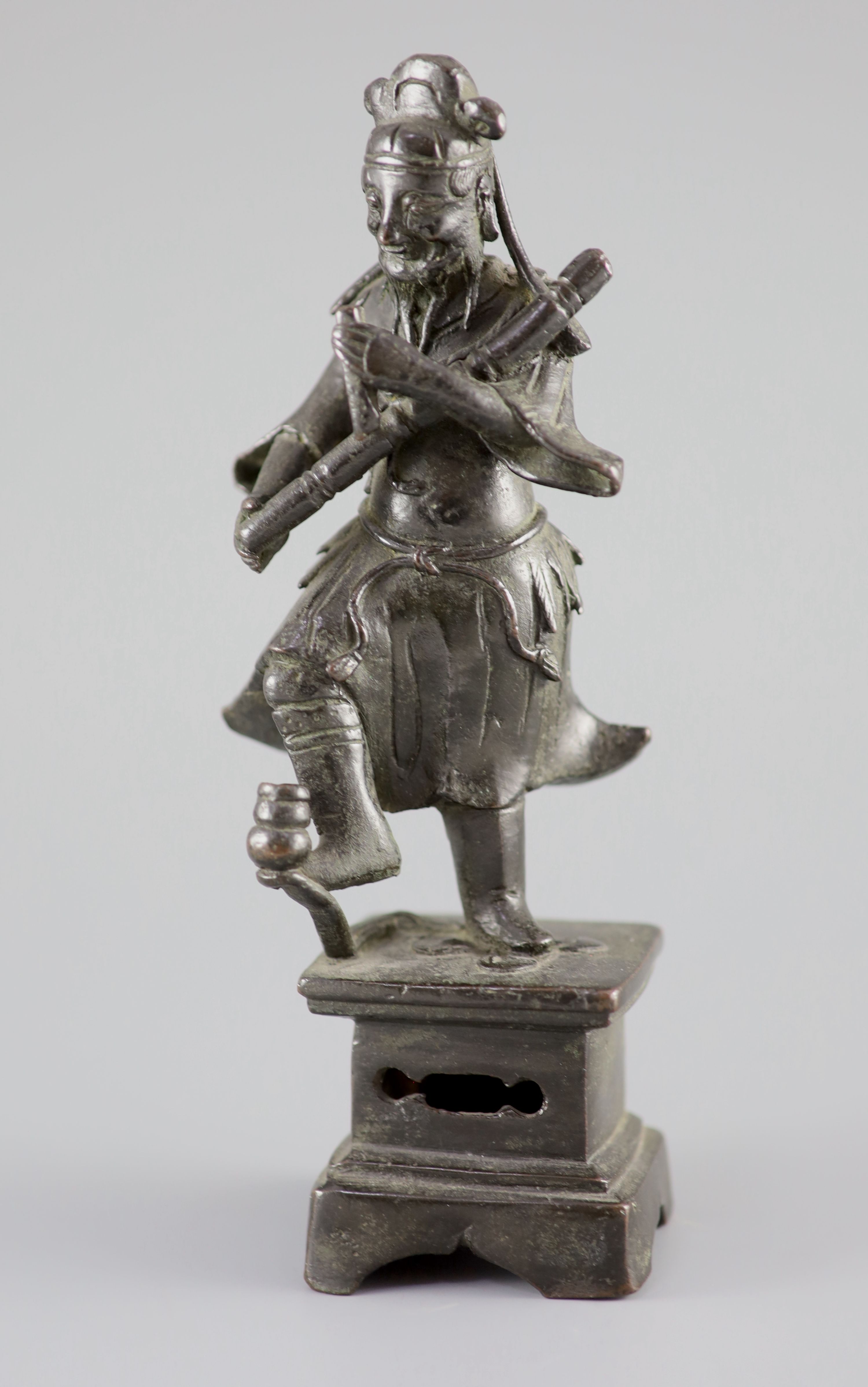A Chinese bronze figure of an immortal, late Ming dynasty, 23 cm high